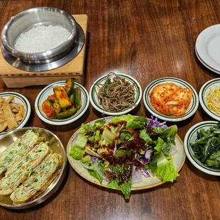 Egg roll/omelet to the left of salad. Subbed for croaker that's supposed to come with combo on menu.