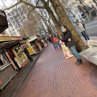 a man standing on a street corner