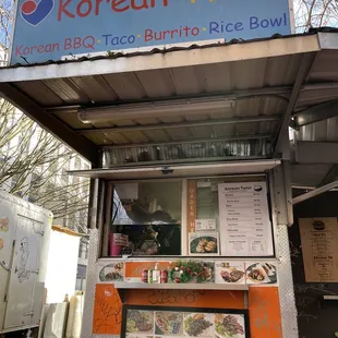 a food truck with a menu on it