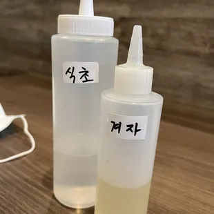 Vinegar &amp; Liquid mustard (very hot like horseradish/wasabi). This is for the cold noodle dish: Neng Myun.