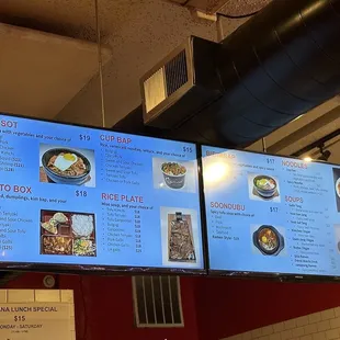 a menu on a large screen in a restaurant