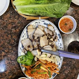 S9. Bossam - boiled pork with pickled radish, lettuce wrap, salty shrimp dipping sauce, ssamjang, &amp; raw garlic and jalapeños : delicious!
