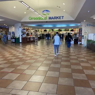 a woman walking through the store