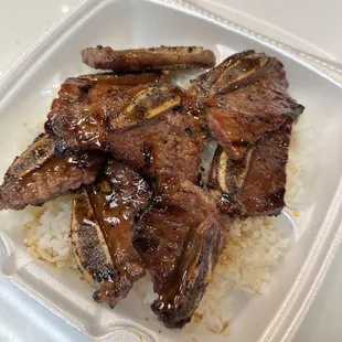 a close up of a meal in a styrofoam container