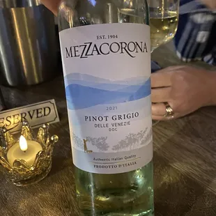 a person holding a bottle of wine