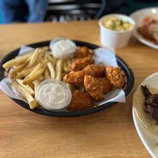 Boneless Buffalo wings with fries