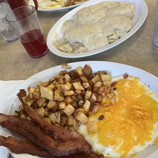 "Eggs your way" plates, biscuits and gravy