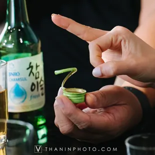 a person&apos;s hand holding a small piece of food