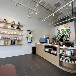 a coffee shop with shelves of coffee