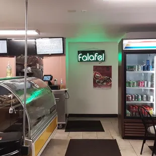 Interior shot. Fairly small space with a couple tables. No sign indicating there's no dine-in but it's only big enough for 1 party.