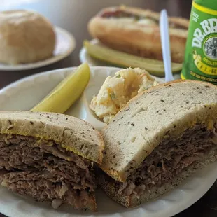Brisket sandwich with mustard, potato salad, hot dog, and a potato knish. Perfect!