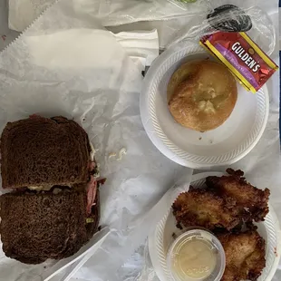 Pastrami on pumpernickel+pickle, latkes &amp; knish.