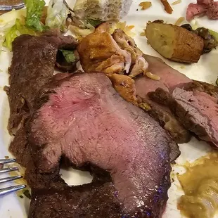 a plate of meat and vegetables