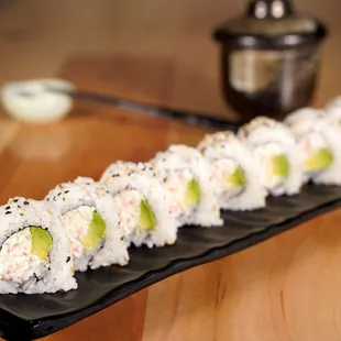 a sushi roll with avocado
