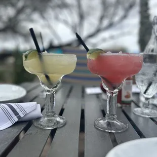 two cocktails sitting on a table