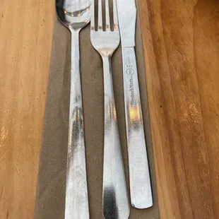 A rare genuine soda spoon along with other useful utensils.