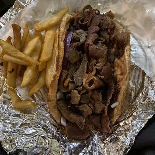 a steak sandwich and french fries