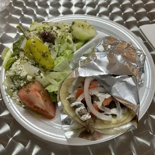 Gyro sandwich and Greek salad