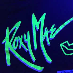 a neon sign with the word kosta on it
