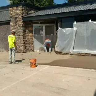 a man standing in front of a building