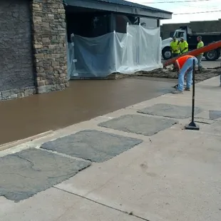workers working on a sidewalk