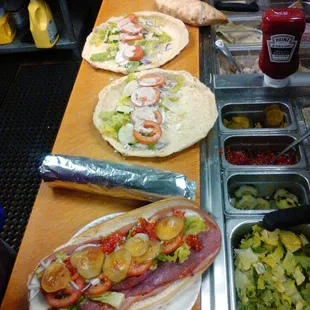 italian sub, couple of greek wraps waiting for chicken,