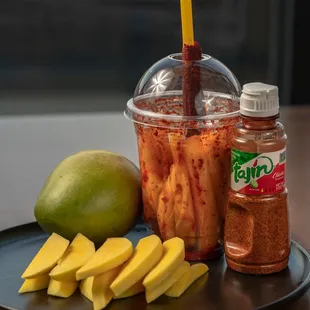 a plate of fruit and a drink on a table
