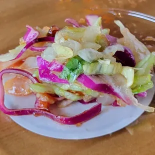 Kotaco salad has red cabbage and lettuce with a Korean cider dressing.