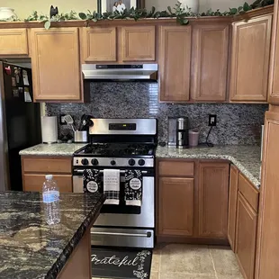 Granite countertop and island by Kotenkoff .