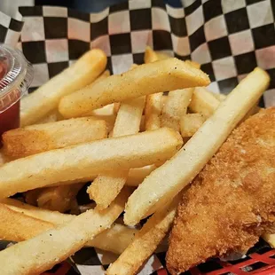 a basket of fried fish and french fries