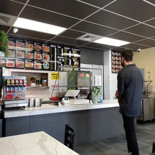 a man standing at the counter
