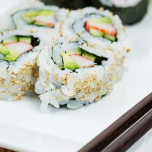 a plate of sushi rolls