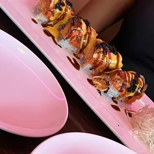 a long plate of sushi