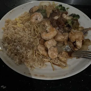 Rice, noodles, shrimp, steak, chicken and vegetables