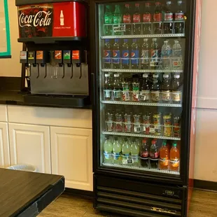 a coke machine and a soda machine