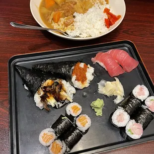 a plate of sushi and a bowl of soup