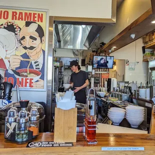 a man preparing food in a restaurant