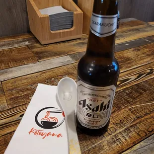 a bottle of ramen and a spoon