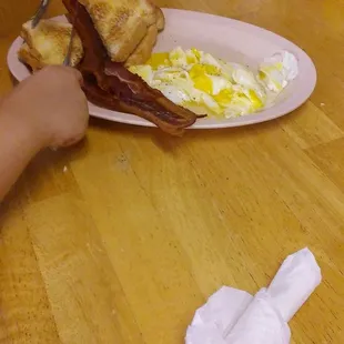 a plate of eggs and toast