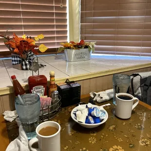 a table with cups of coffee