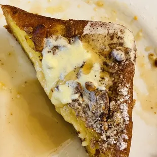 french toast stuffed with peach cream cheese, topped with granola.