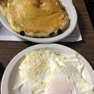 a plate of eggs and pancakes