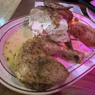 What&apos;s left of delicious half chicken after we cut off a couple chunks.