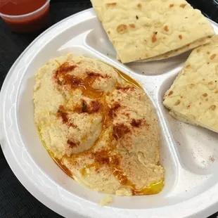 a plate of hummus and pita