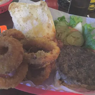 Burger in sourdough bun with awesome onion rings