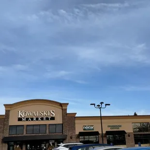 two cars parked in front of the store