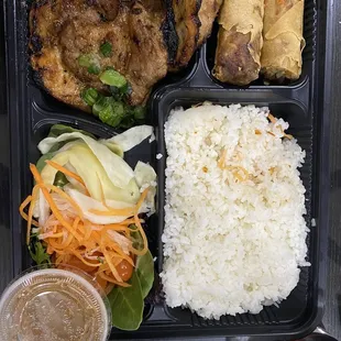 Broken rice with charbroiled pork and egg roll.. DELICIOUSSSSSS