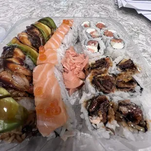 Assorted sushi - Highland roll, sunset roll, Philly roll, dragon roll