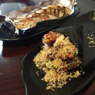 Weirdest Salmon skin hand roll that I&apos;ve ever been served. Tasted good, but you couldn&apos;t hold it. I had to kill it with my chopsticks.