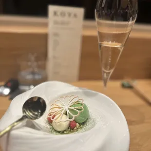 a plate of food and a glass of wine